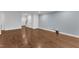Spacious basement with hardwood floors, neutral walls, and access to an upstairs level at 644 Angelica Cir, Cary, NC 27518