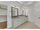 Well-lit bathroom with double sink, granite vanity, and walk-in closet nearby at 644 Angelica Cir, Cary, NC 27518