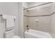 Full bathroom with a tiled shower and tub combination, modern fixtures and hardware at 644 Angelica Cir, Cary, NC 27518