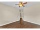 Spacious bedroom featuring hardwood floors, neutral walls, and a ceiling fan at 644 Angelica Cir, Cary, NC 27518