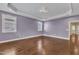 Spacious bedroom boasts hardwood floors and modern ceiling with recessed lighting at 644 Angelica Cir, Cary, NC 27518