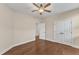 Bedroom boasts wood floor, ceiling fan, and easy access to another room at 644 Angelica Cir, Cary, NC 27518