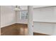 Bedroom with hardwood floors, a window with a backyard view, and a walk-in closet at 644 Angelica Cir, Cary, NC 27518