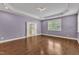 Spacious bedroom features tray ceiling, hardwood floors, and bright windows at 644 Angelica Cir, Cary, NC 27518