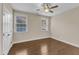 Bedroom features two windows for natural light and wood floors at 644 Angelica Cir, Cary, NC 27518