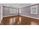 Spacious bedroom features tray ceiling, hardwood floors, and bright windows at 644 Angelica Cir, Cary, NC 27518
