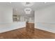 Open dining area with white trim and molding, hardwood floors, and view into the kitchen area at 644 Angelica Cir, Cary, NC 27518
