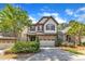 Charming two-story home featuring a stone facade and well-manicured landscaping at 644 Angelica Cir, Cary, NC 27518