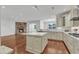 Modern kitchen with granite countertops, stainless steel appliances, and center island at 644 Angelica Cir, Cary, NC 27518