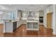 Beautiful kitchen with stainless steel appliances, granite countertops, a kitchen island, and hardwood floors at 644 Angelica Cir, Cary, NC 27518