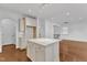 Kitchen island featuring granite countertops, cabinet storage, and seating area, with an open-concept design at 644 Angelica Cir, Cary, NC 27518