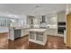 Beautiful kitchen with stainless steel appliances, granite countertops, a kitchen island, and hardwood floors at 644 Angelica Cir, Cary, NC 27518