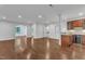Spacious living room with hardwood floors and an open floor plan to the kitchen, perfect for entertaining at 644 Angelica Cir, Cary, NC 27518