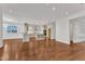 Spacious living area with hardwood floors and view to a modern kitchen at 644 Angelica Cir, Cary, NC 27518