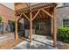 View of the patio under wood deck and brick siding at 644 Angelica Cir, Cary, NC 27518
