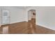 Inviting room featuring hardwood floors, neutral walls, and access to the exterior, blending indoor and outdoor spaces at 644 Angelica Cir, Cary, NC 27518