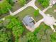 This home has a big yard and is surrounded by mature trees, a long driveway, and manicured landscaping at 6509 Duncans Creek Ct, Fuquay Varina, NC 27526