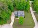 Overhead view of a beautiful home, driveway, surrounded by mature trees at 6509 Duncans Creek Ct, Fuquay Varina, NC 27526