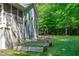 Expansive backyard featuring a screened porch, raised garden beds, and a lush green lawn at 6509 Duncans Creek Ct, Fuquay Varina, NC 27526