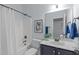 Bathroom with a shower and tub, accented by stylish decor at 6509 Duncans Creek Ct, Fuquay Varina, NC 27526