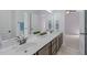 An en-suite bathroom features a double vanity at 6509 Duncans Creek Ct, Fuquay Varina, NC 27526