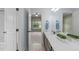 Bright bathroom showcasing a double vanity and en-suite access to bedroom at 6509 Duncans Creek Ct, Fuquay Varina, NC 27526
