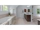 Bright bathroom featuring a soaking tub and wooden cabinets at 6509 Duncans Creek Ct, Fuquay Varina, NC 27526