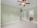 Bedroom featuring neutral carpet, a ceiling fan, and en-suite bathroom at 6509 Duncans Creek Ct, Fuquay Varina, NC 27526