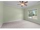 Bedroom with neutral carpet and light green walls at 6509 Duncans Creek Ct, Fuquay Varina, NC 27526