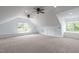 Large bonus room with vaulted ceilings, recessed lighting, and natural light from windows at 6509 Duncans Creek Ct, Fuquay Varina, NC 27526