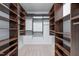 Spacious walk-in closet features custom shelving and ample storage, perfect for organization at 6509 Duncans Creek Ct, Fuquay Varina, NC 27526
