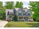 Charming two-story home with a well-manicured lawn, beautiful landscaping and welcoming front porch at 6509 Duncans Creek Ct, Fuquay Varina, NC 27526