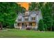 Eye-catching two-story home with a landscaped front yard, a spacious porch and charming architectural details at 6509 Duncans Creek Ct, Fuquay Varina, NC 27526