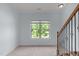 Bright hallway with a window and staircase leading to other parts of the home at 6509 Duncans Creek Ct, Fuquay Varina, NC 27526