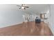 Open-concept living area with hardwood floors seamlessly connecting to the modern kitchen at 6509 Duncans Creek Ct, Fuquay Varina, NC 27526