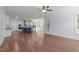 Spacious living room with hardwood flooring, open layout and views of the modern kitchen at 6509 Duncans Creek Ct, Fuquay Varina, NC 27526