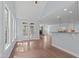 Open concept living space bathed in natural light, and featuring an access door to a porch at 6509 Duncans Creek Ct, Fuquay Varina, NC 27526