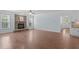 Spacious living room with hardwood flooring, fireplace, and ample light at 6509 Duncans Creek Ct, Fuquay Varina, NC 27526