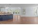 Open-concept living space with island and abundant natural light at 6509 Duncans Creek Ct, Fuquay Varina, NC 27526