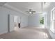 Spacious primary bedroom with tray ceilings and a view of the ensuite at 6509 Duncans Creek Ct, Fuquay Varina, NC 27526