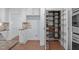 A bright pantry features shelving and pull-out wire basket storage at 6509 Duncans Creek Ct, Fuquay Varina, NC 27526