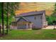 Rear exterior of a house showcasing a patio, yard, and basketball hoop at 6509 Duncans Creek Ct, Fuquay Varina, NC 27526