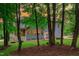 Back exterior showing a porch and yard, framed by trees at 6509 Duncans Creek Ct, Fuquay Varina, NC 27526