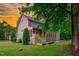 Beautiful backyard with a screened porch, well-maintained lawn, and mature landscaping for privacy at 6509 Duncans Creek Ct, Fuquay Varina, NC 27526
