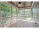 Relax on the screened porch with wood floors and ceiling fan overlooking the backyard at 6509 Duncans Creek Ct, Fuquay Varina, NC 27526