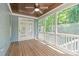 View of the screened porch with double doors leading to backyard at 6509 Duncans Creek Ct, Fuquay Varina, NC 27526