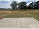 Spacious backyard area with a concrete patio, perfect for outdoor entertaining at 67 Commons Cir, Clayton, NC 27520
