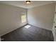 Bright bedroom with soft carpet, neutral walls, and a sun-filled window offering a serene atmosphere at 67 Commons Cir, Clayton, NC 27520