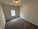 Cozy bedroom featuring plush carpet, neutral paint, and a sunny window for a relaxing retreat at 67 Commons Cir, Clayton, NC 27520