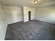 Spacious bedroom with soft carpet and neutral walls providing a serene and inviting retreat at 67 Commons Cir, Clayton, NC 27520
